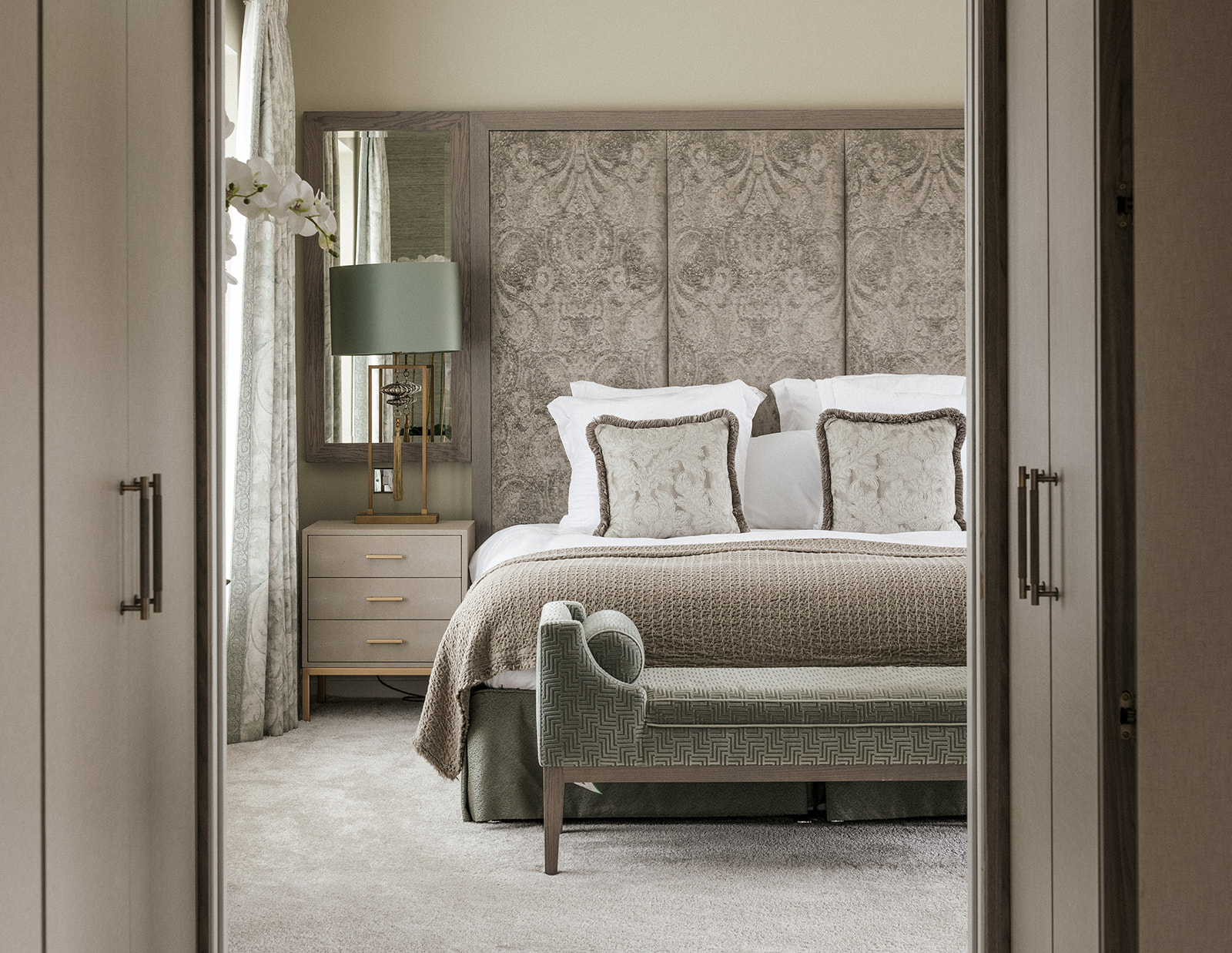 Witham Project bedroom suite — finished director-led residential interior showcasing soft furnishings, layered lighting, and bespoke joinery